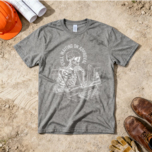 Still Waiting on Approval Skeleton Desk Construction Humor Unisex Jersey Short Sleeve Tee